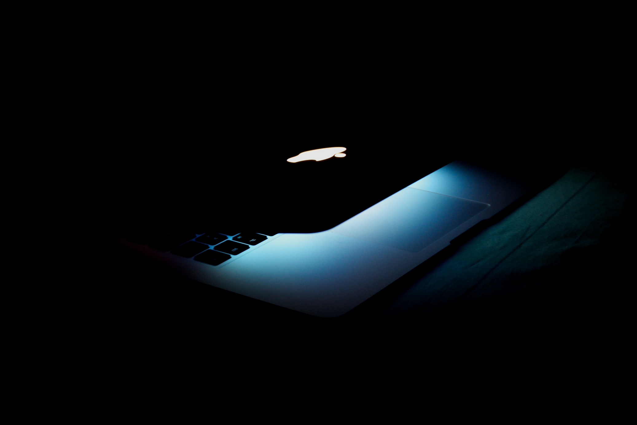 Photography of a Turned On Macbook